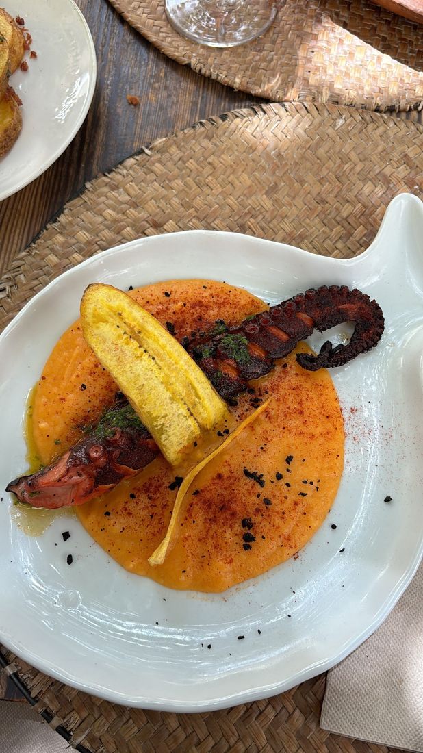 Grilled octopus with plantain and romesco
