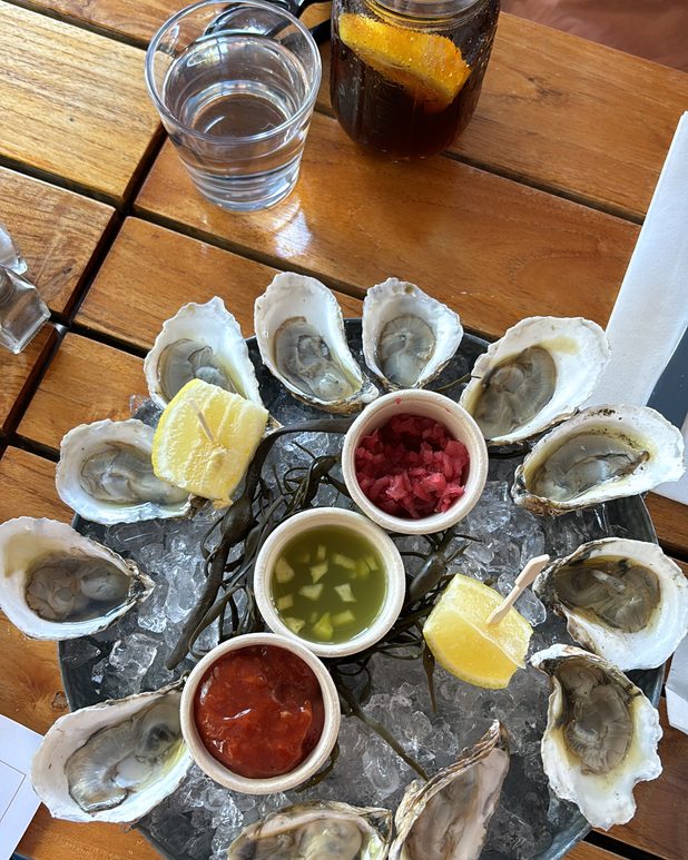 Oysters on ice with three sauces and lemon