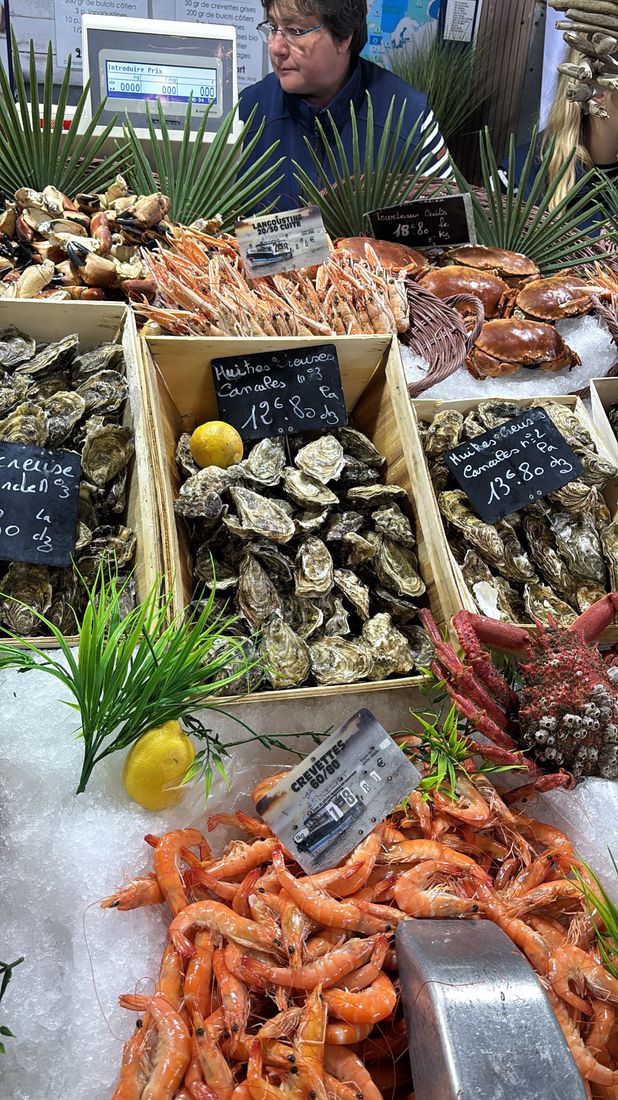 Oysters, langoustines, and crab at a seafood market stall